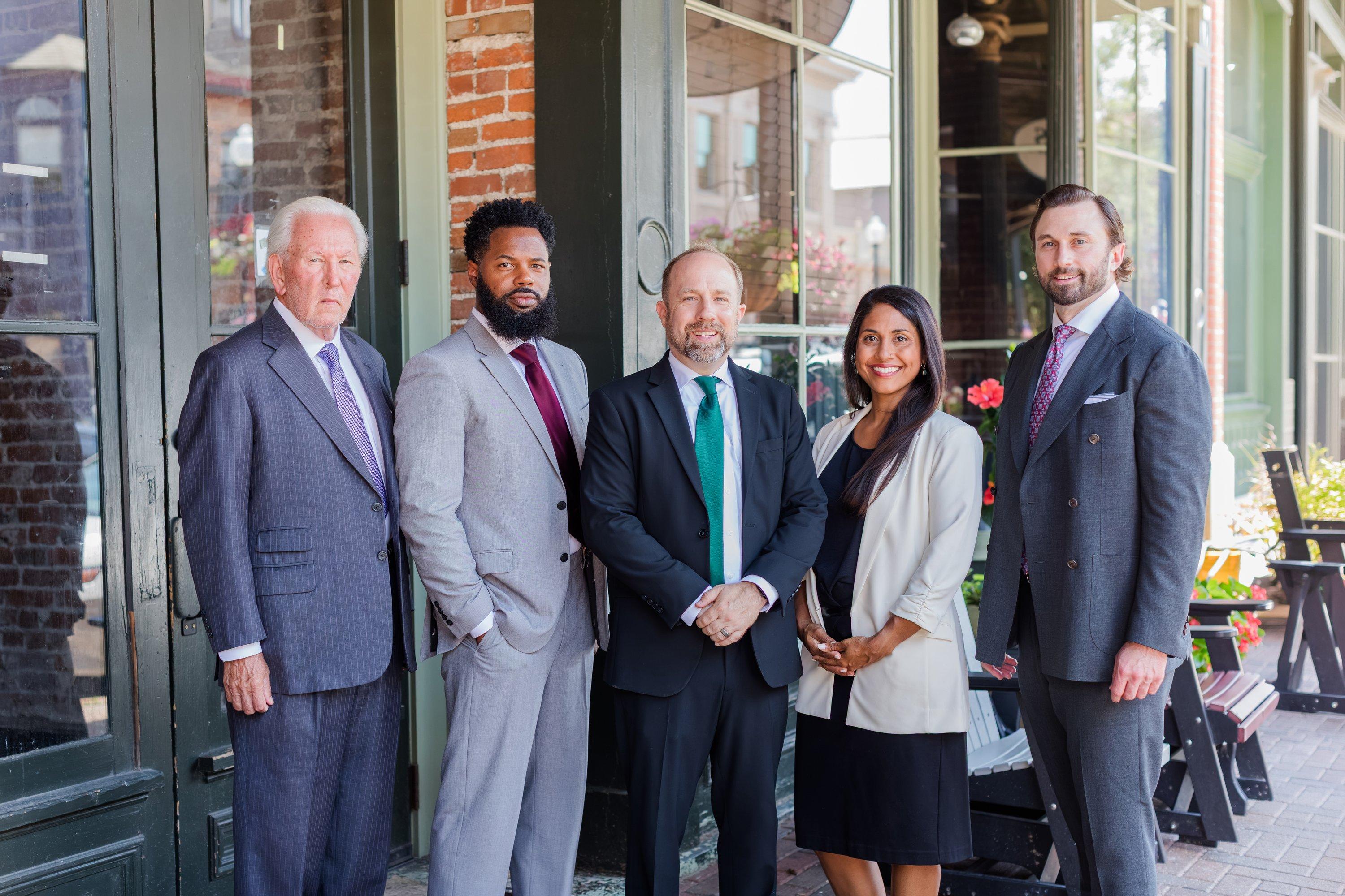 A JMH Law attorney meeting with clients