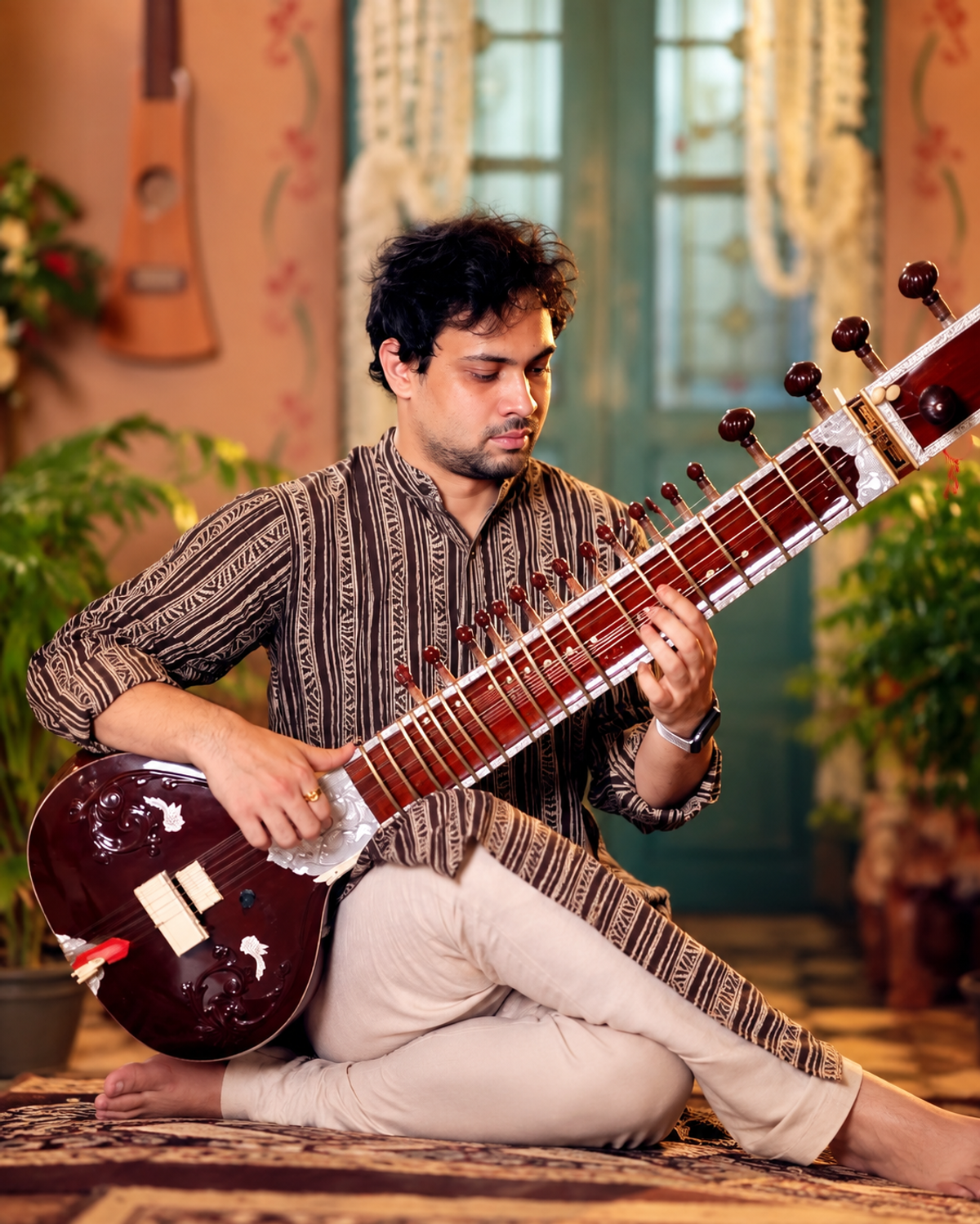 Sweekar playing his Sitar