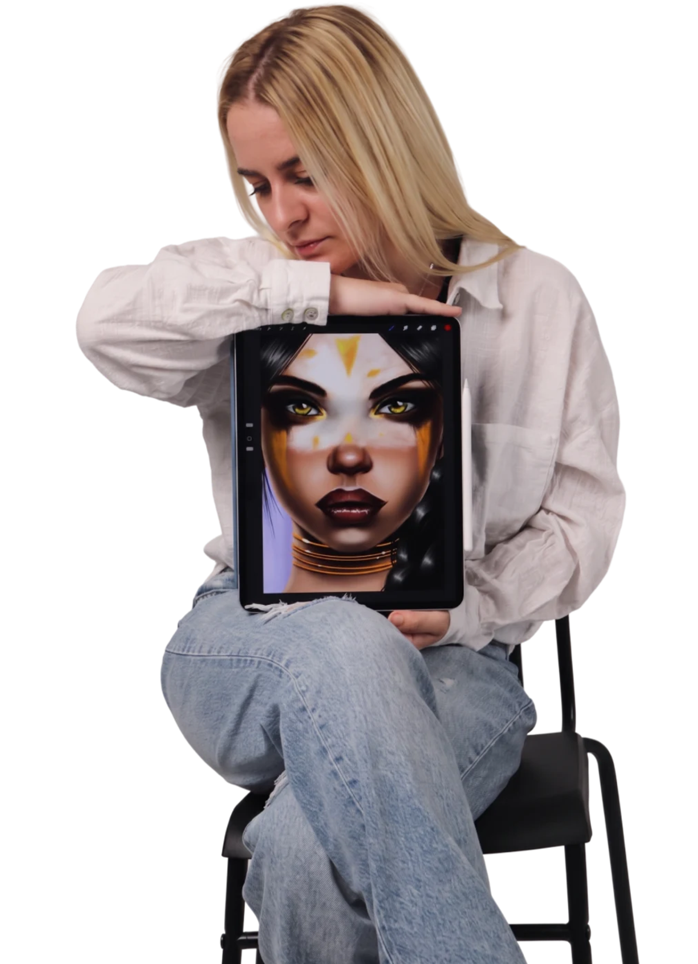 Elena sitting on a chair, holding a tablet with a digital portrait painting