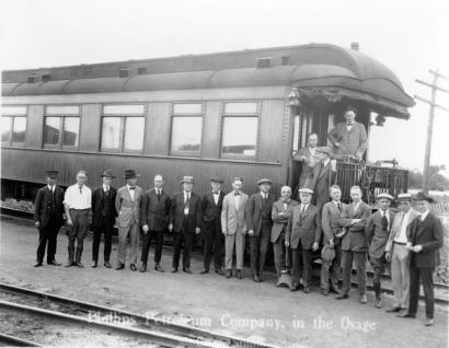 image from Frank Phillips (on bottom step) and other oilmen arrive in Osage territory in 1919.