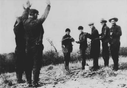 image from Al Spencer Gang members jokingly hold up others in their crew