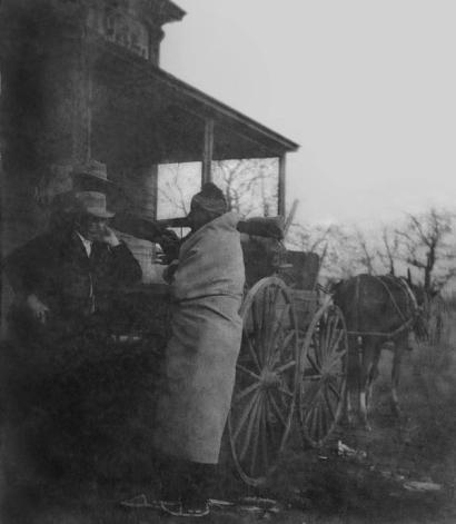 image from Mollie’s father (right) in front of Florer’s trading store.014 Courtesy of Raymond Red Corn