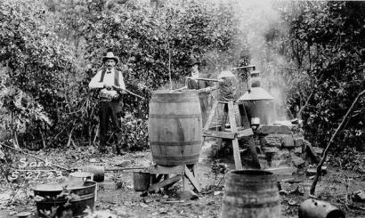 image from Lawmen seize a moonshine still in Osage County in 1923.