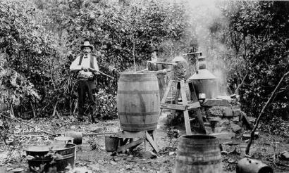 image from Lawmen seize a moonshine still in Osage County in 1923.