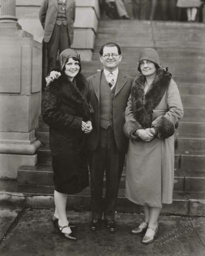 image from A transformed Hale standing with his wife and daughter.