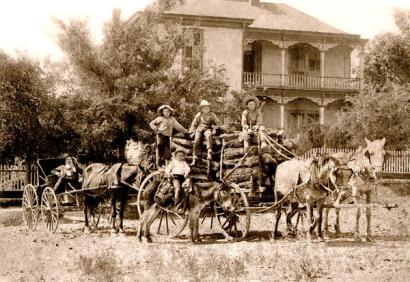 image from Tom (standing to the left) and his brothers, including Doc (on the donkey) and Dudley (far right).