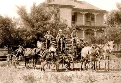 image from Tom (standing to the left) and his brothers, including Doc (on the donkey) and Dudley (far right).