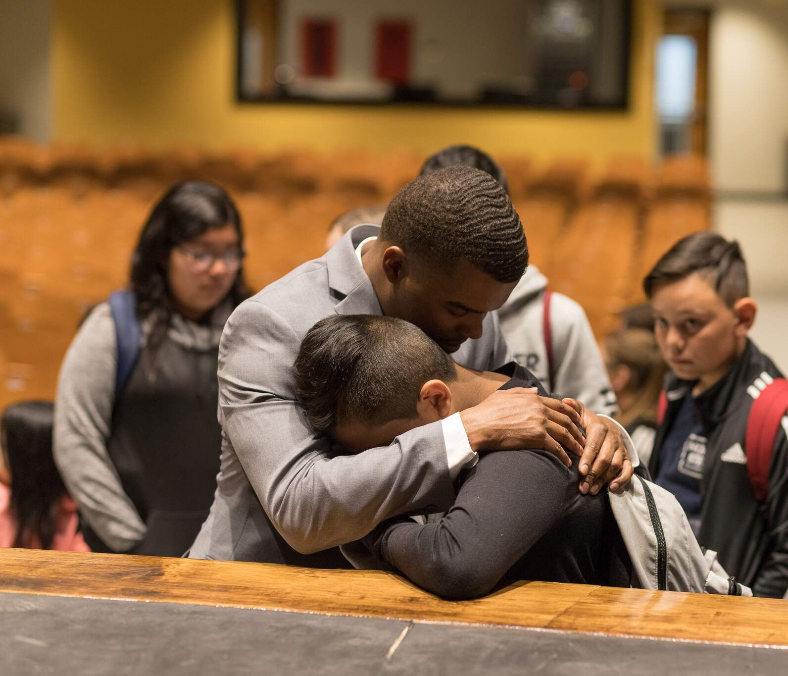 Matt hugging a student