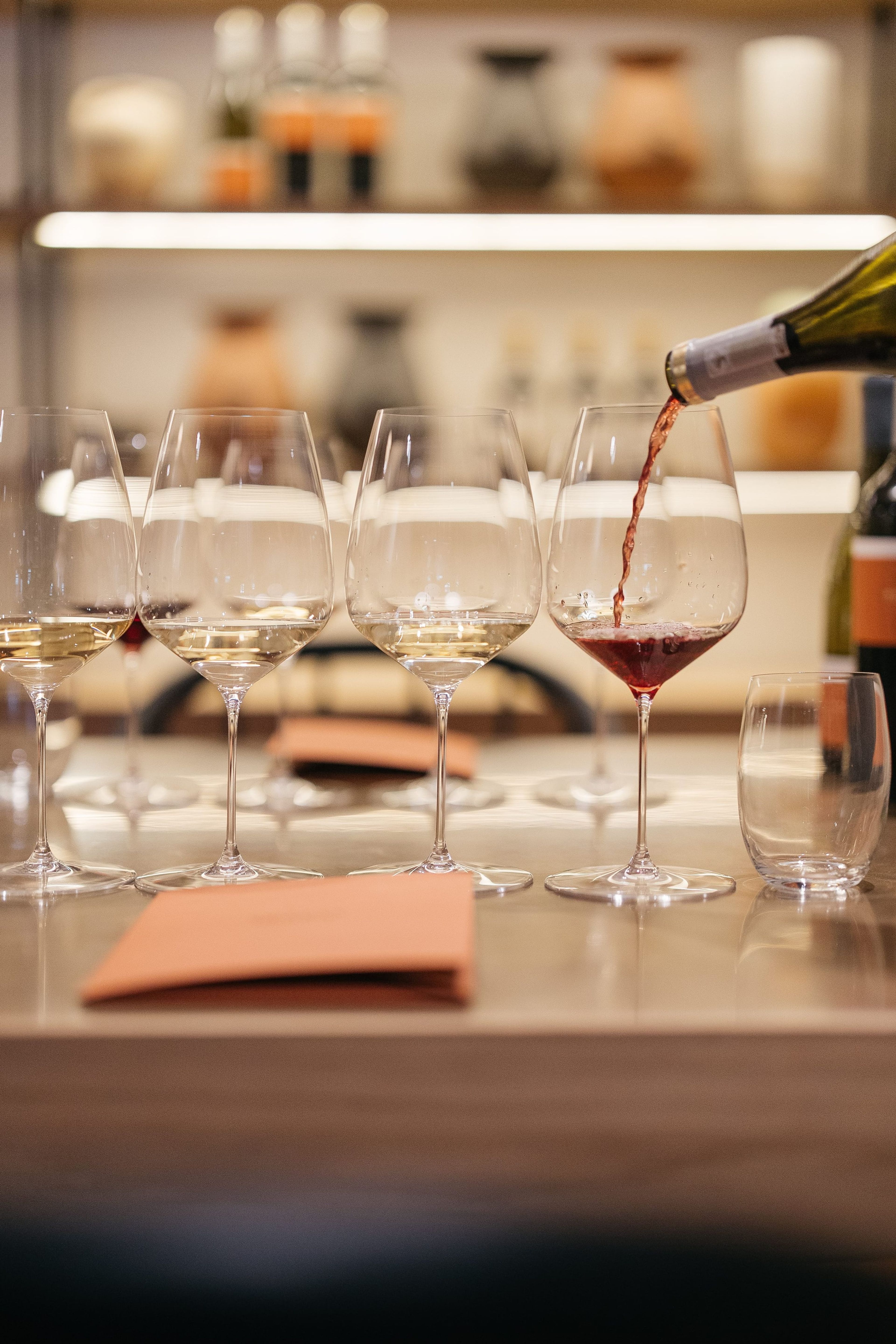 Wine being poured into tasting glasses at Rickety Bridge
