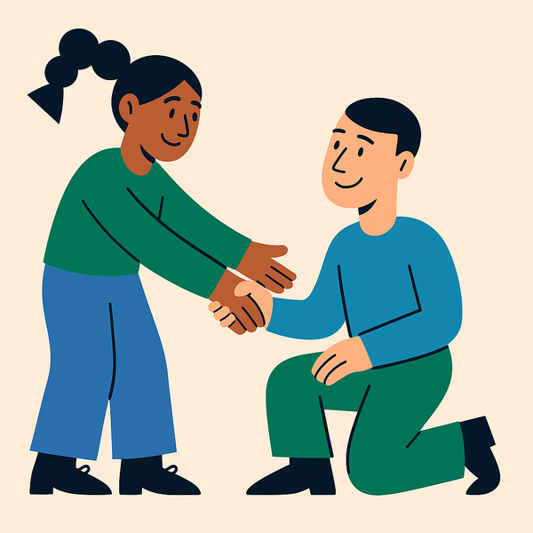 En mann kneler og håndhilser på en kvinne.