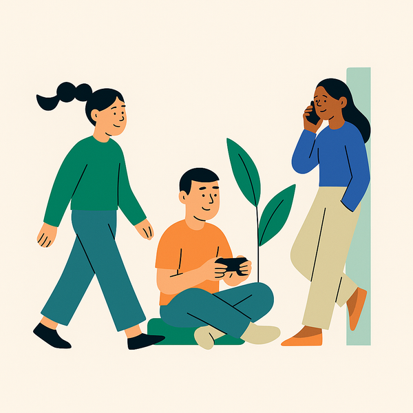 En mann sitter på bakken og spiller et videospill mens en kvinne snakker i mobiltelefon.