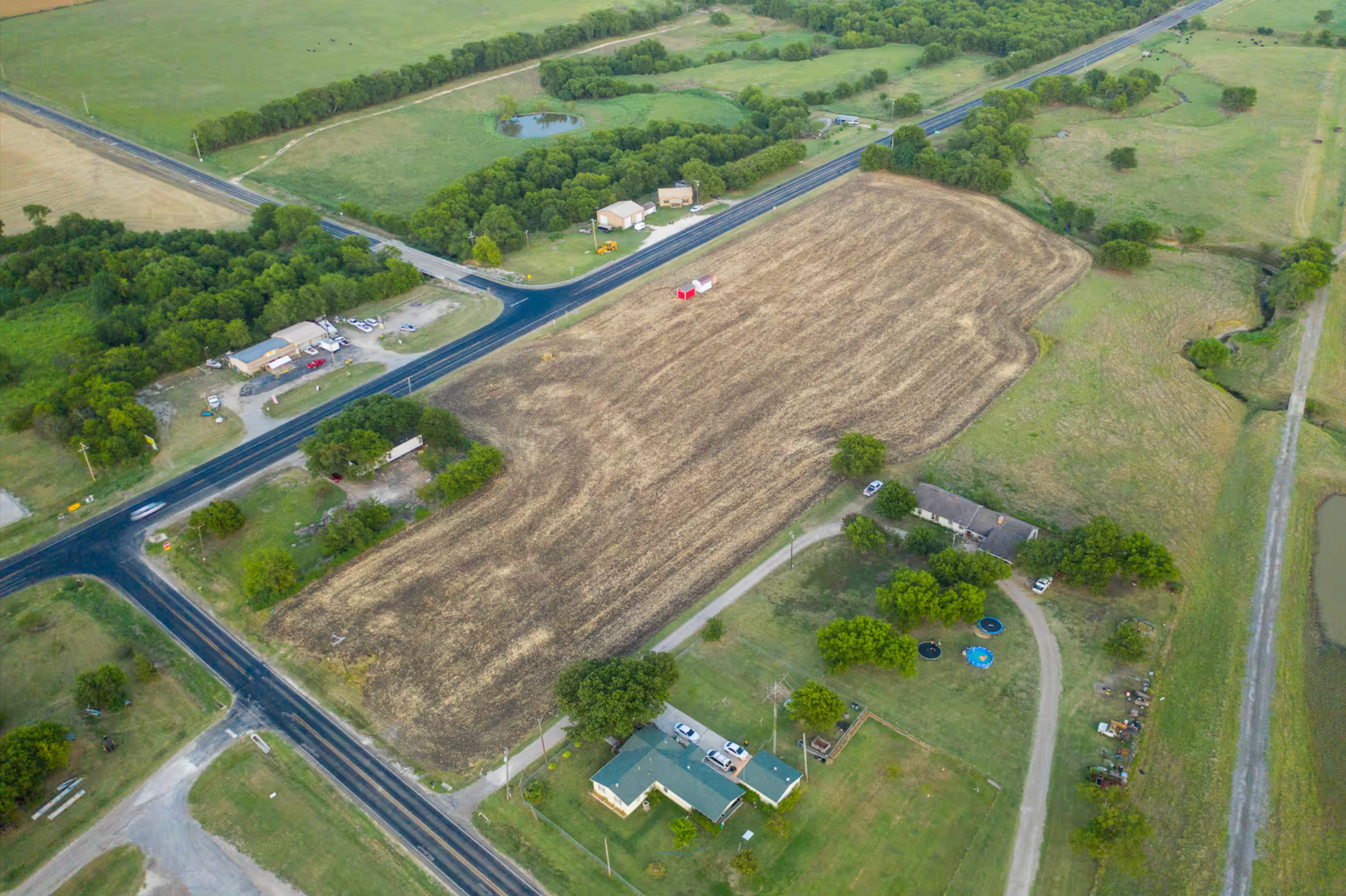 The beginning — a few buildings lined up on open land, before there was a lot or a shop.
