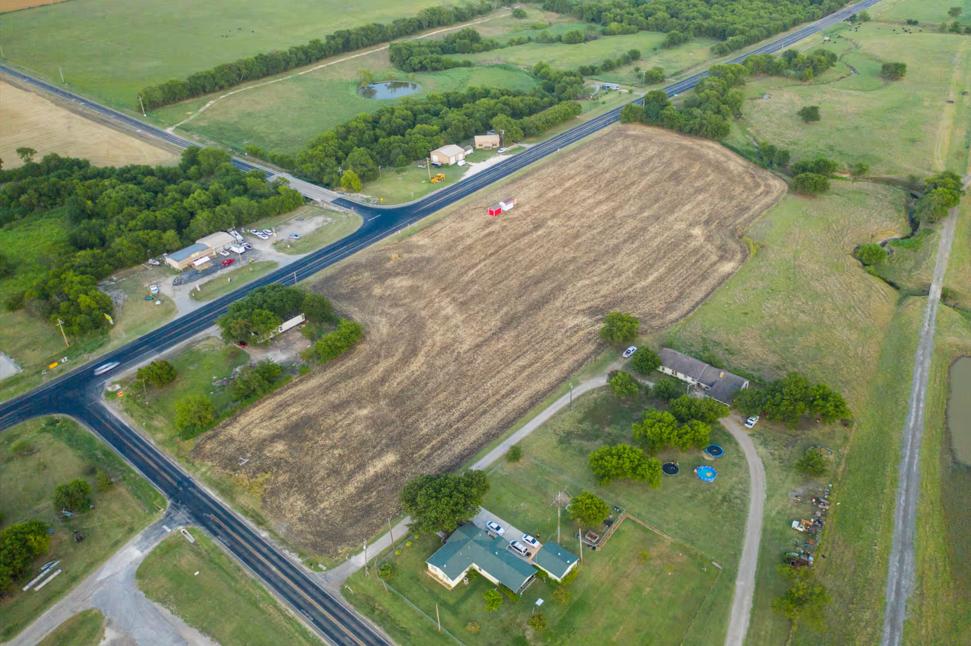 The beginning — a few buildings lined up on open land, before there was a lot or a shop.