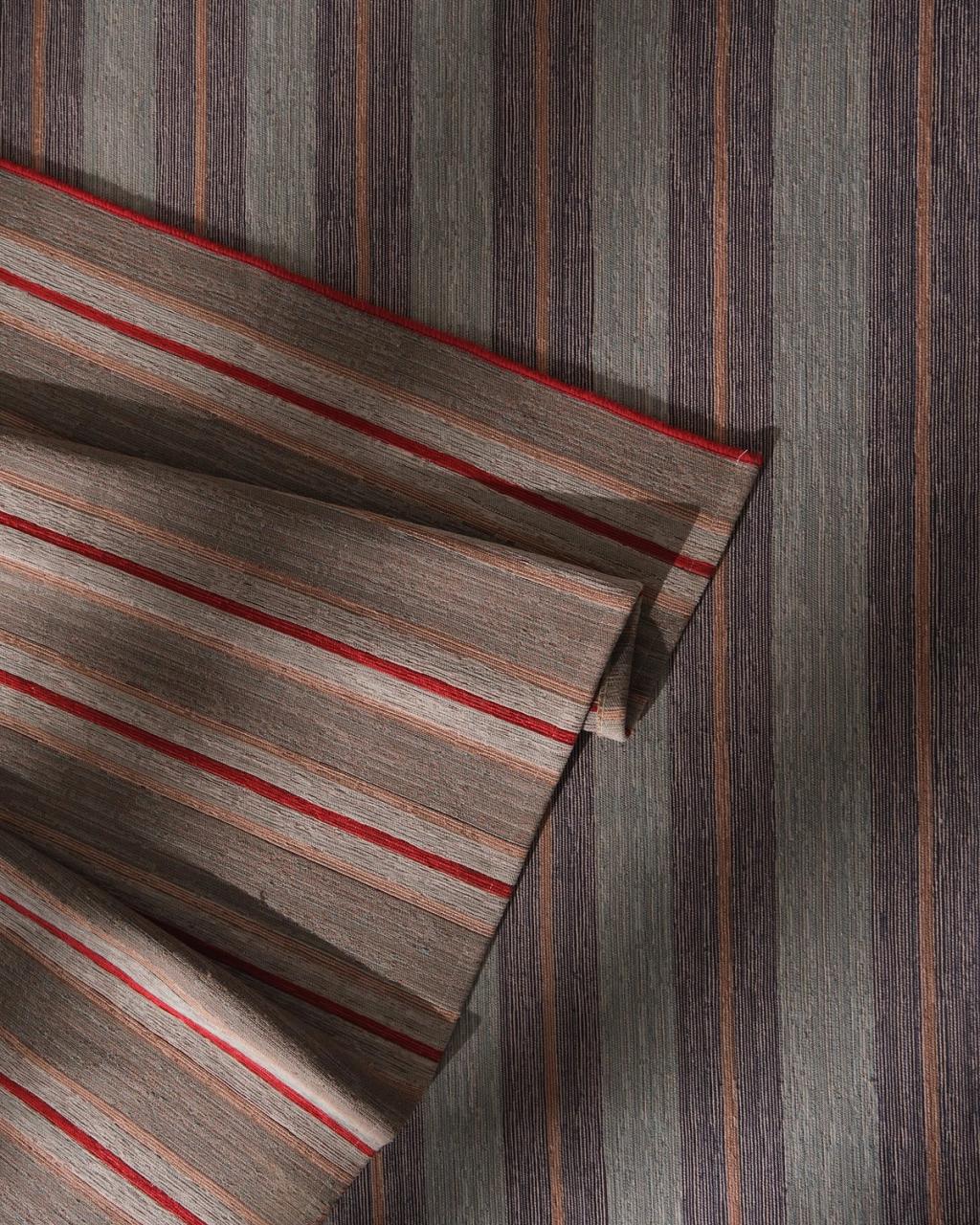 A living room with a beautiful rug