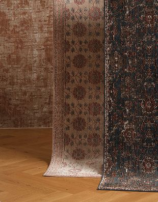 Three washable rugs hanging side by side