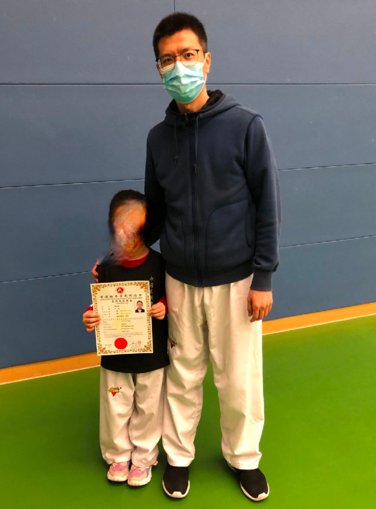 student with certificate and coach