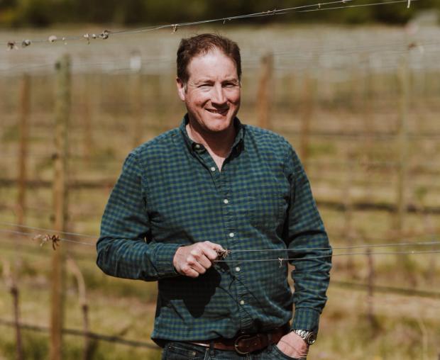 Dylan Roche in the vineyard