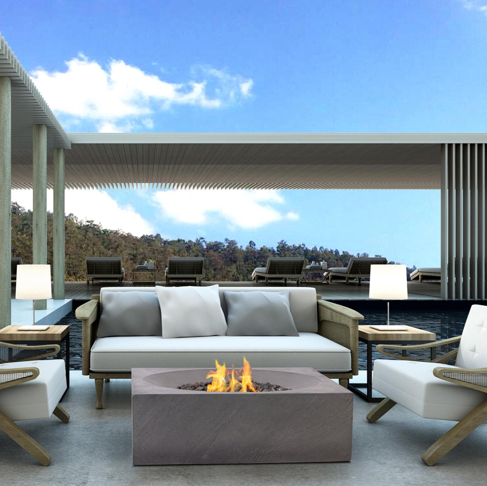 Luxury outdoor kitchen with built-in grill at dusk