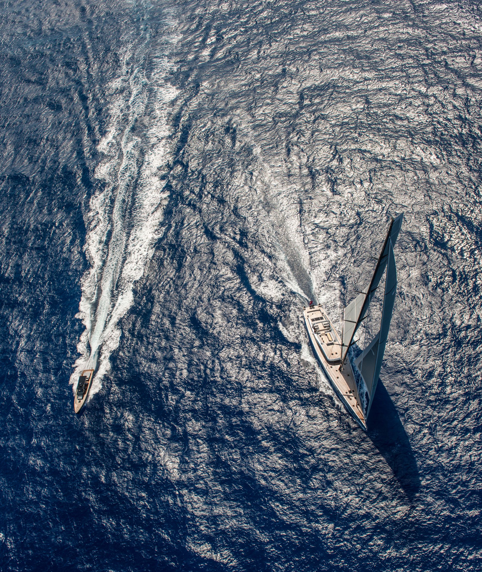 The chase boat accompanying the superyacht Sarissa on a silver sea, rivaling in beauty.