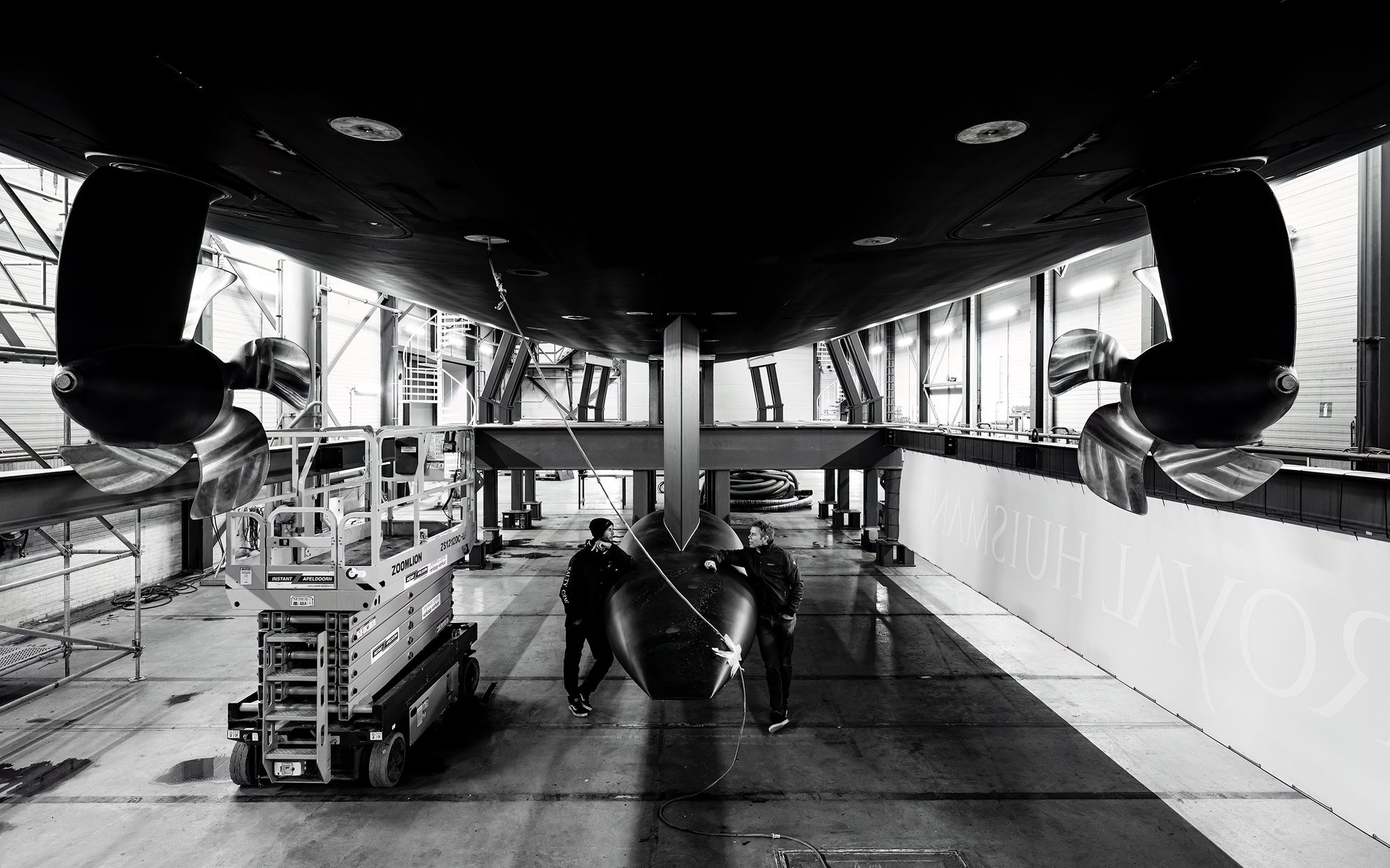 Gregory Monks in discussion with the Sarissa crew during construction.