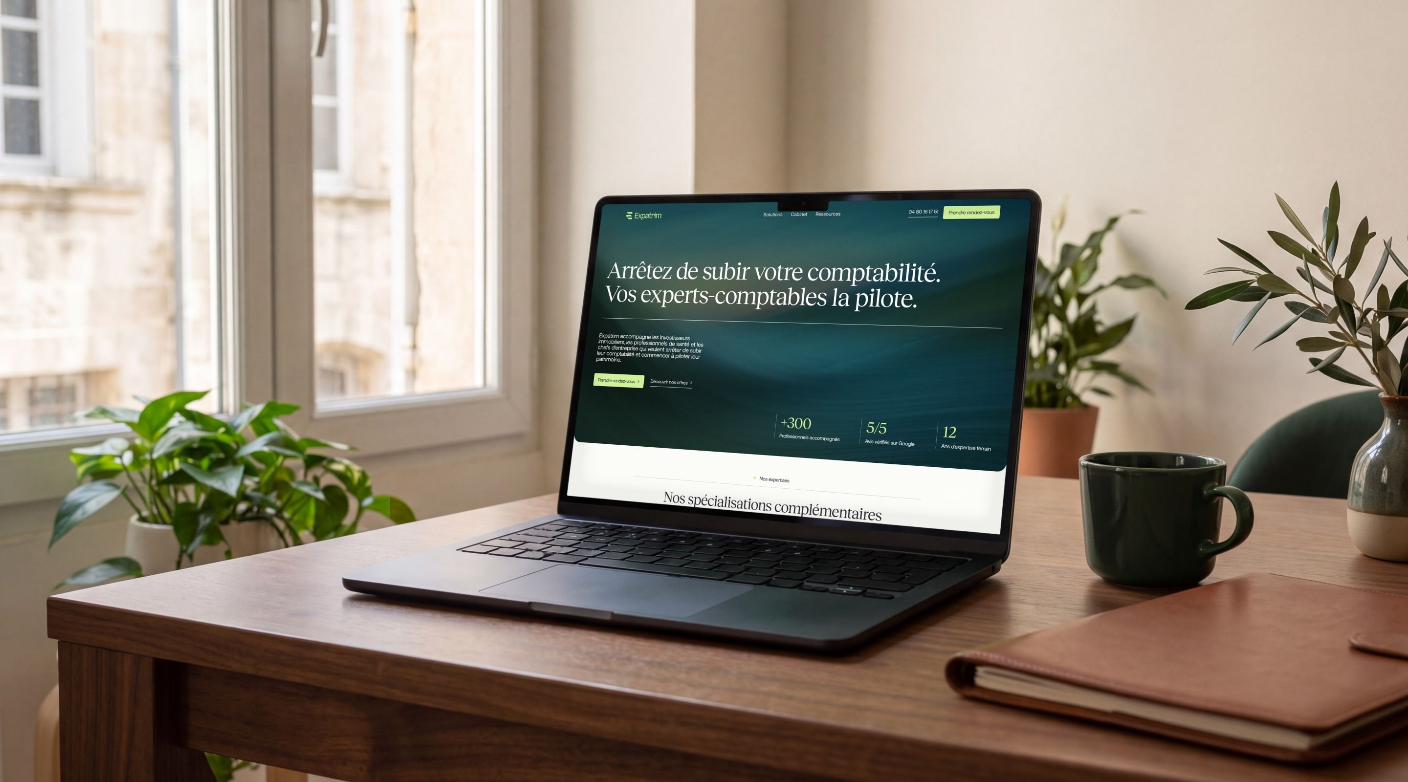 MacBook Pro open on the Expatrim home page, “Stop putting up with your accounting. Your accountants are in control.”
