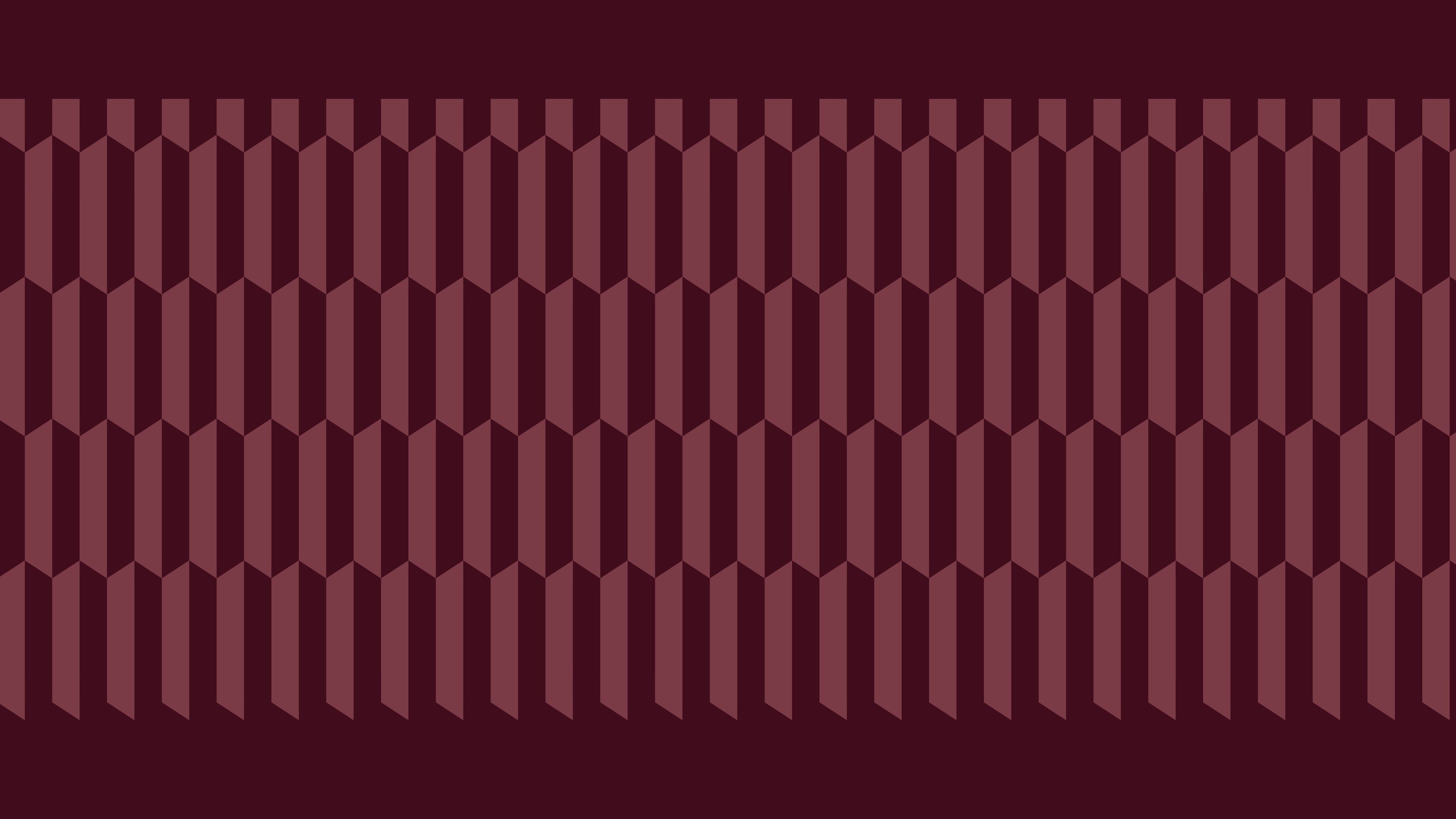 The Perle Noire faceted pattern, in pink on a burgundy background