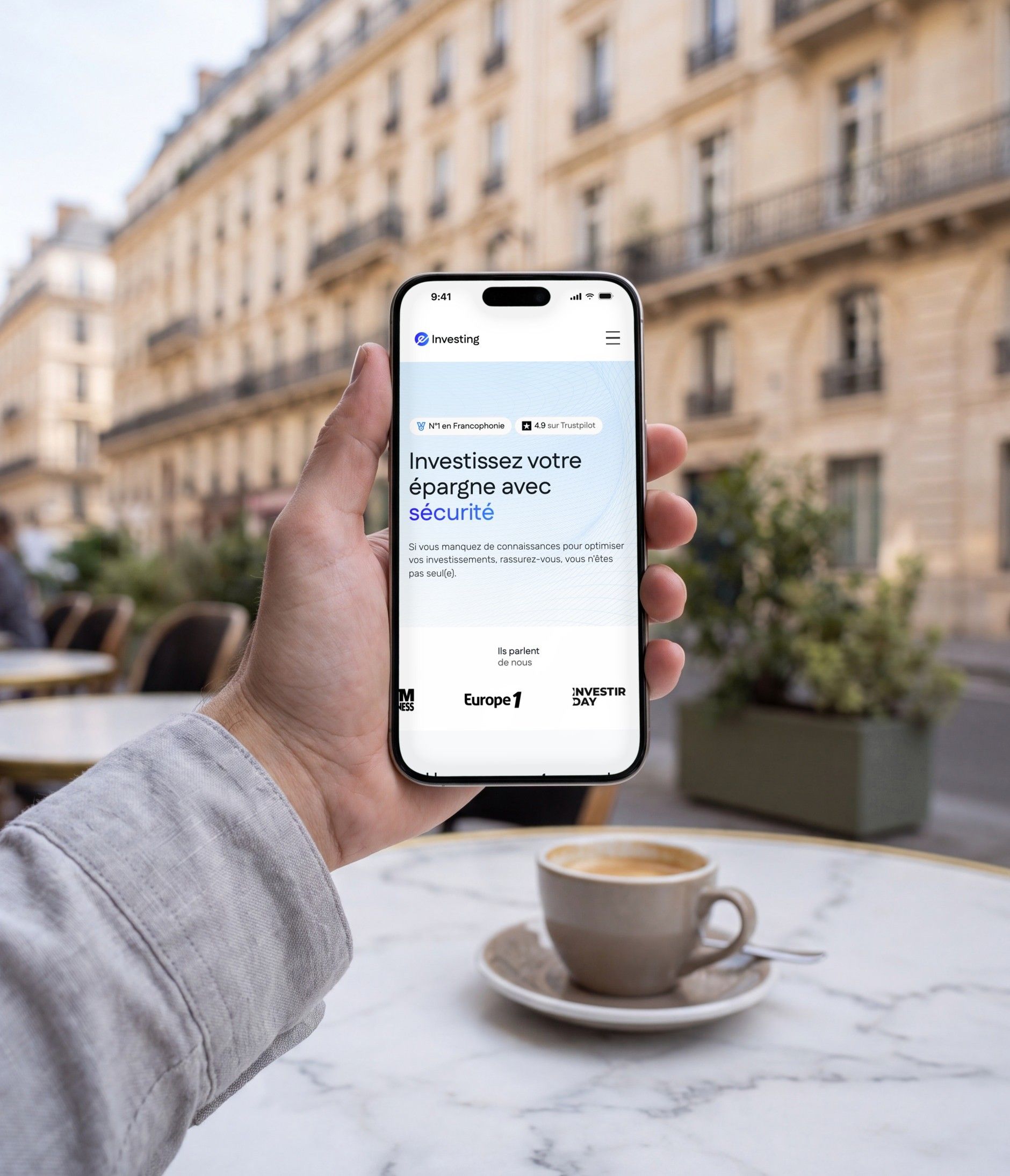 iPhone 16 Pro open on the e-Investing mobile home page