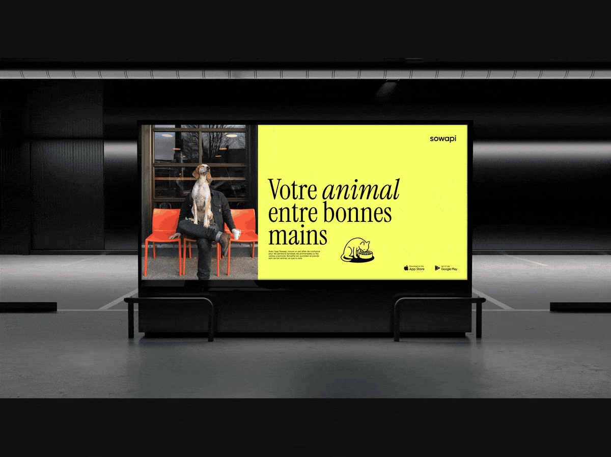 Sowapi billboard in a subway station: dog sitting on a man, yellow panel reading “Votre animal entre bonnes mains”