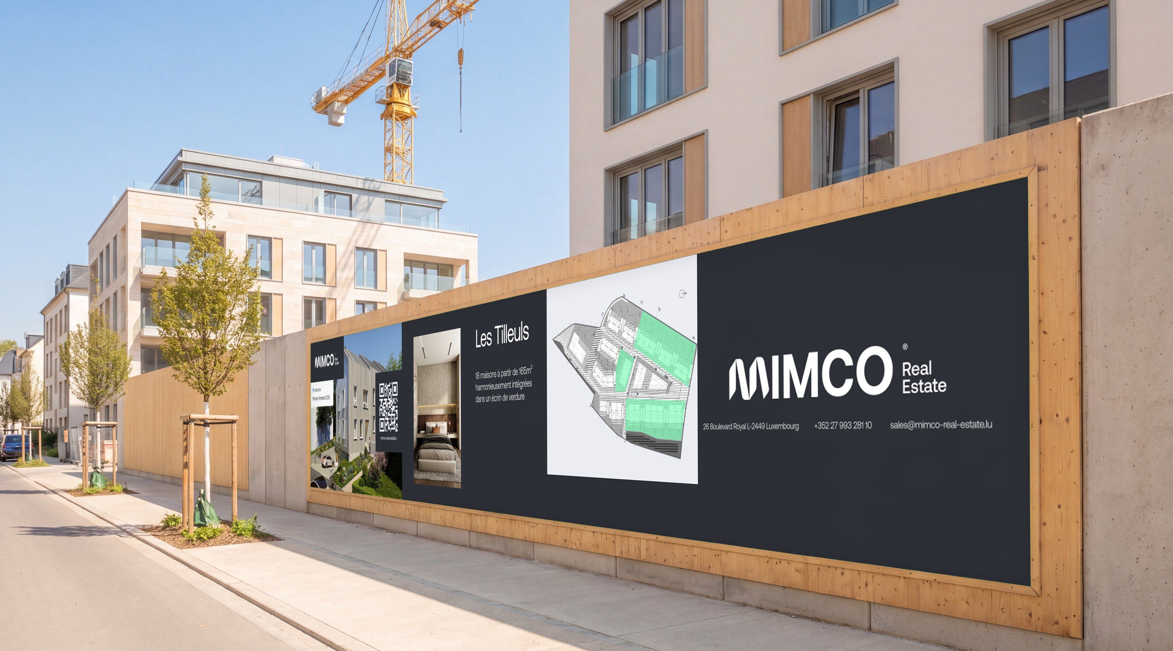 Mimco “Les Tilleuls” hoarding on a construction site fence, in a residential street with a crane