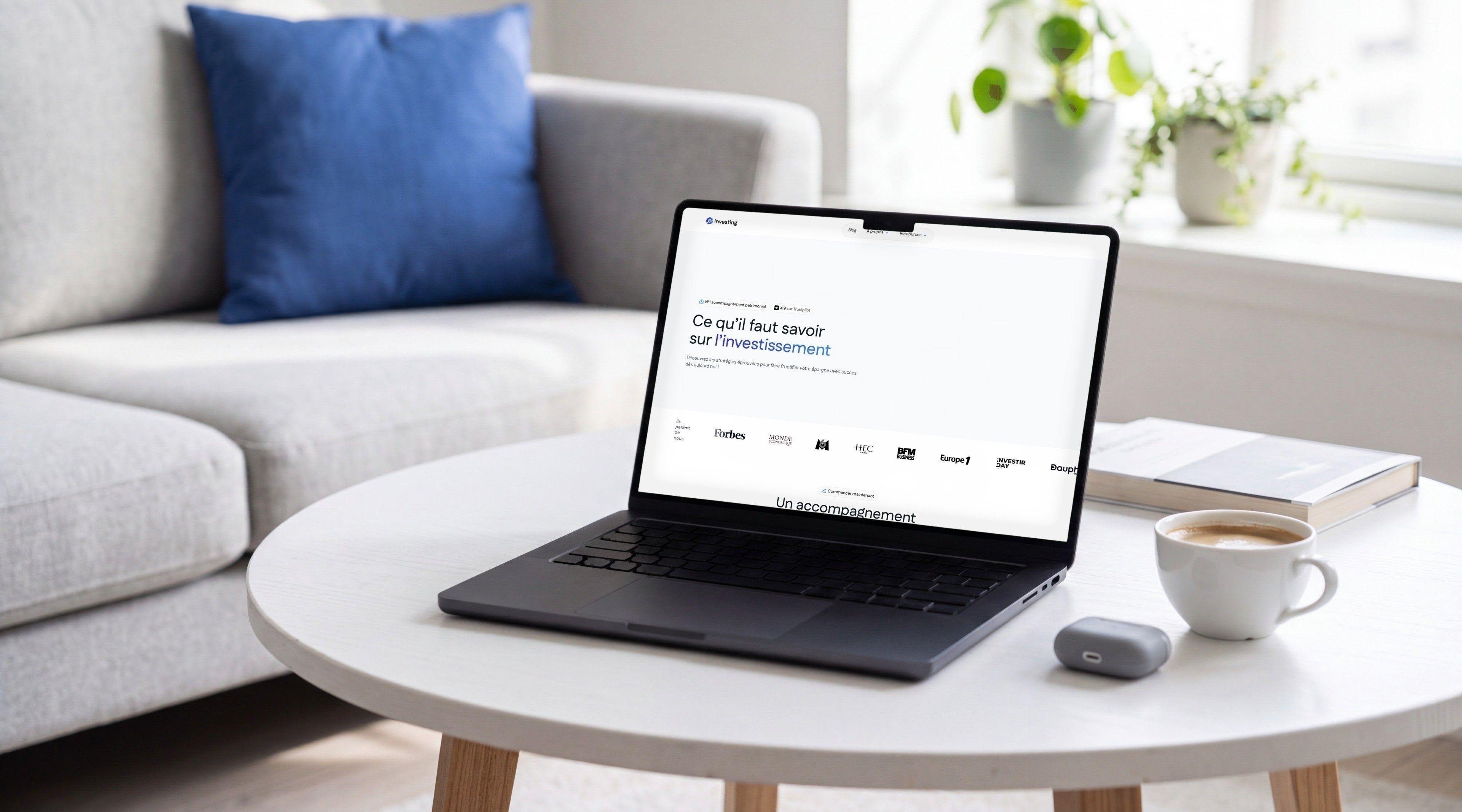 MacBook Pro open on e-Investing's Academy page, “What you need to know about investing”