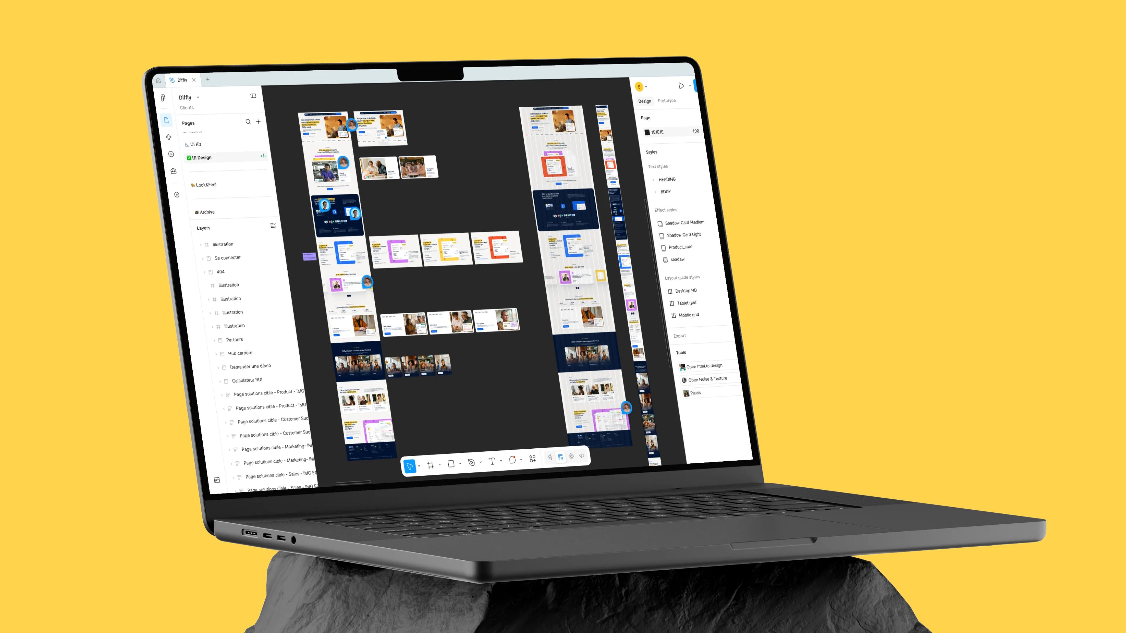 Laptop showing the Diffly website Figma file, with web page mockups and layers on a yellow background