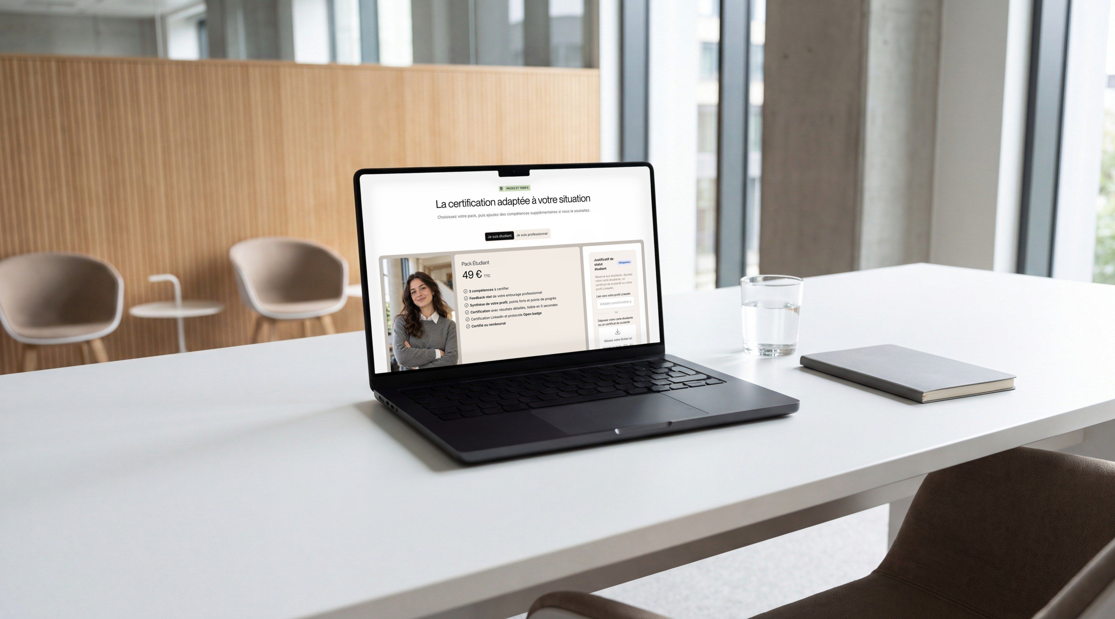 MacBook Pro on a seminar room table, open on the Packs page of the COSS website