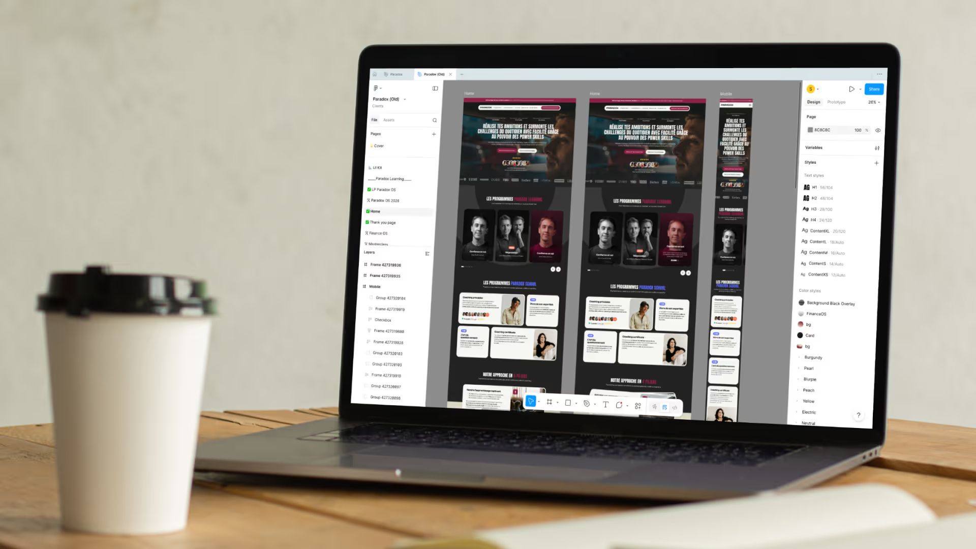 Laptop showing Figma with desktop, tablet and mobile mockups of a Paradox sales page