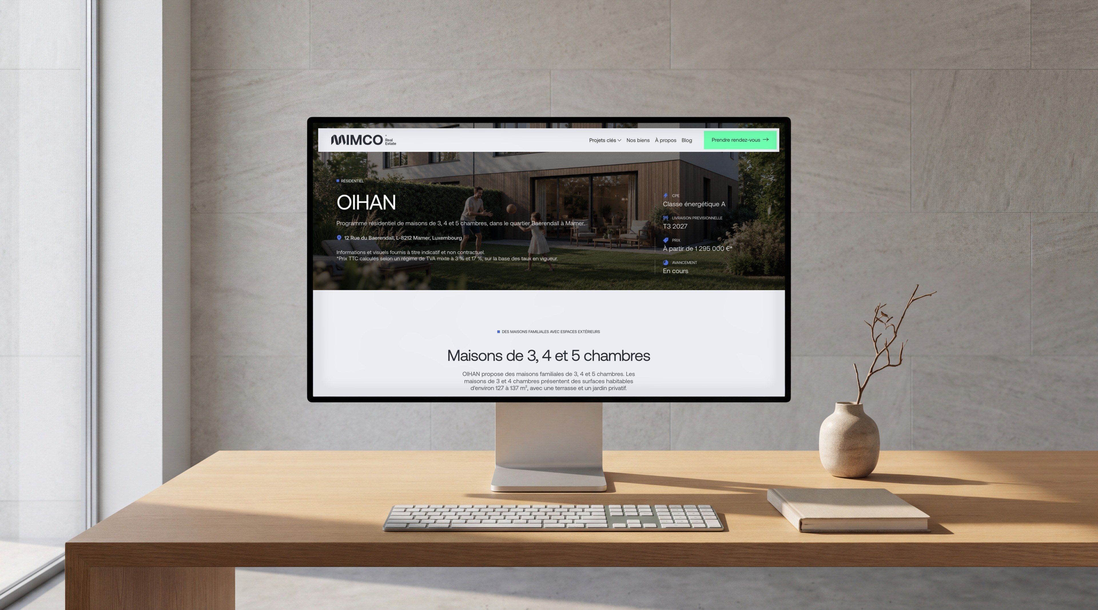 Pro Display XDR on an oak desk in front of a stone wall, open on the OIHAN development page
