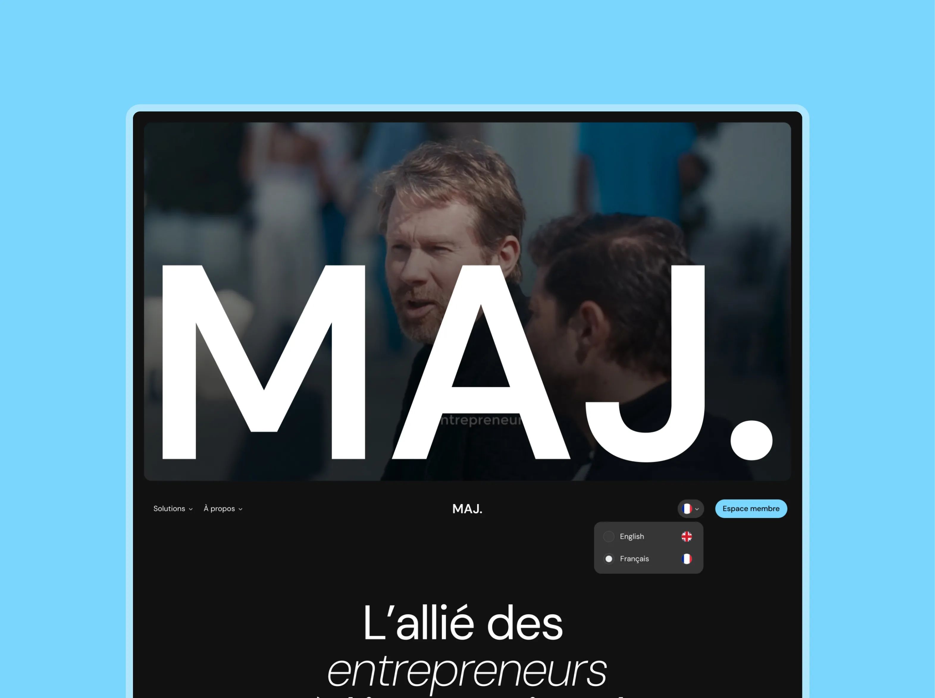 MAJ homepage: giant logotype over a photo of two men, black background, language menu and “L'allié des entrepreneurs”