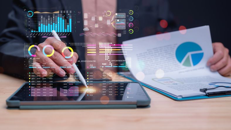 A photo of hands working on a tablet.
