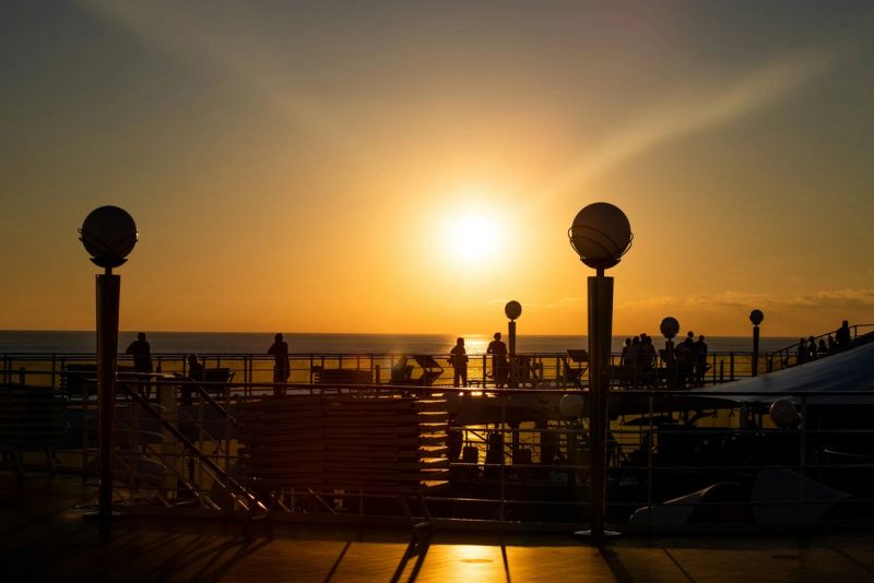 Cruise ship deck at sunset with ocean views