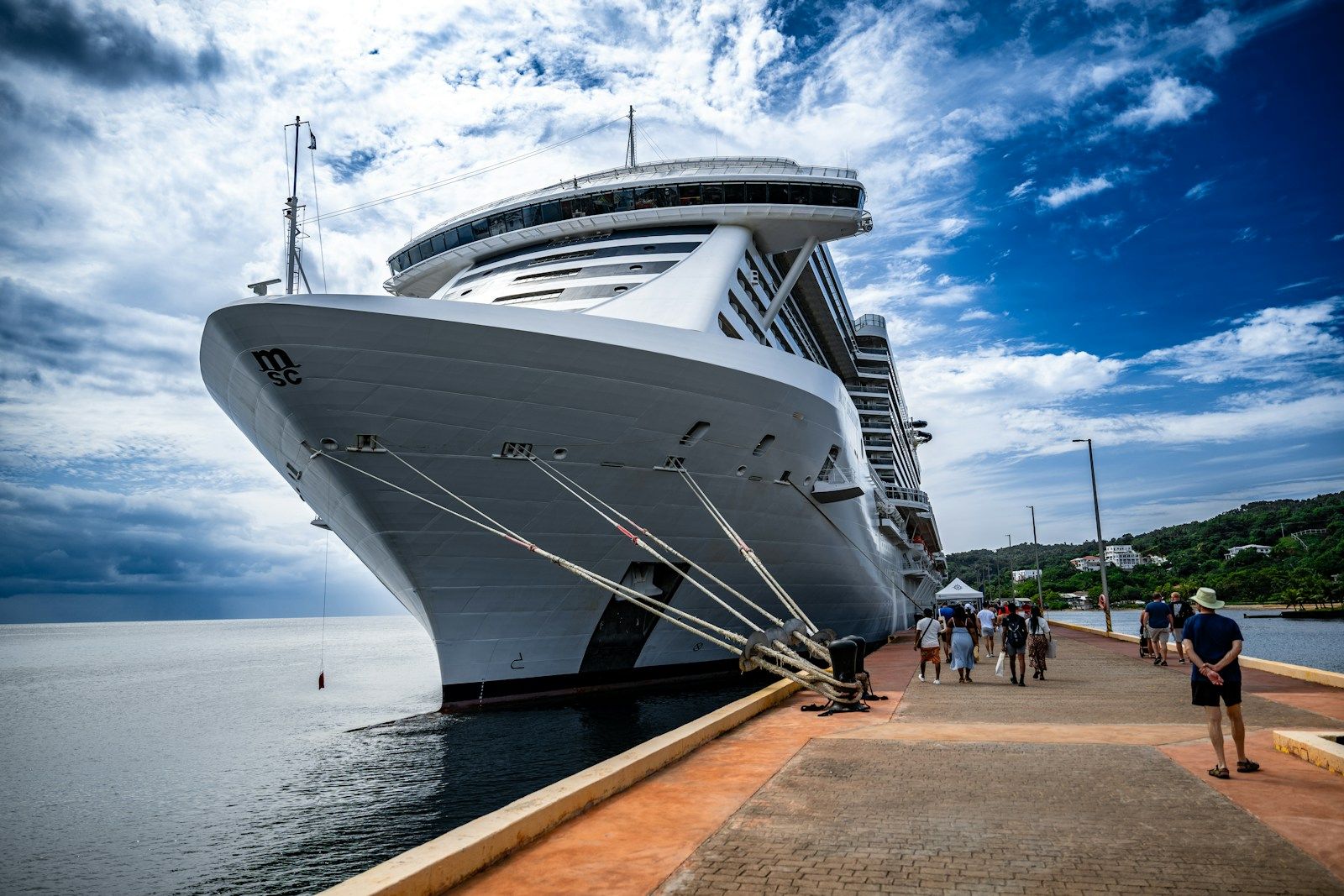 Cruise ship at sea with first-time passengers relaxing on the deck