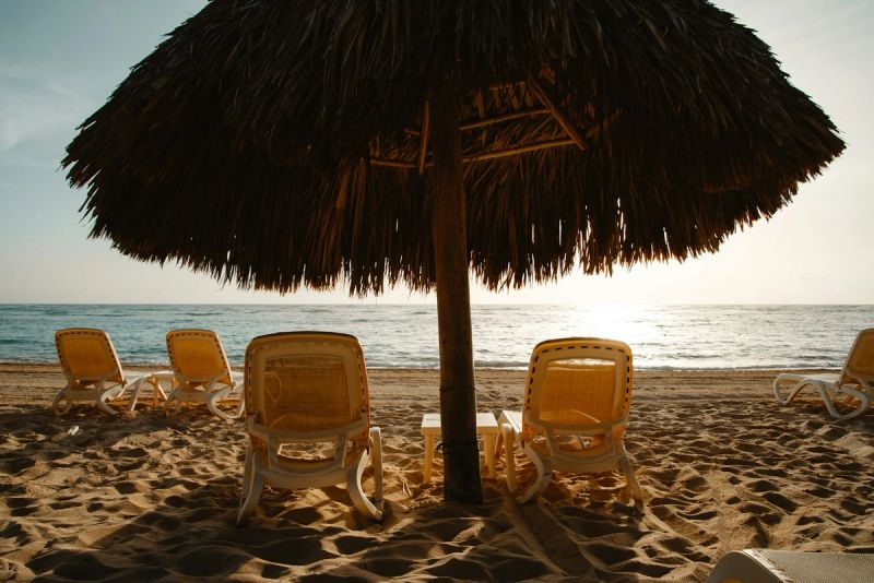 Beachside cabana on a Caribbean island with turquoise water in the background
