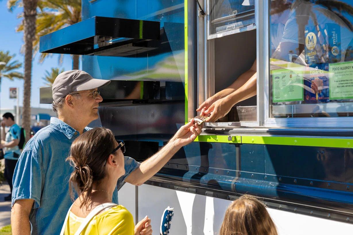 man and child at a marketing pop up