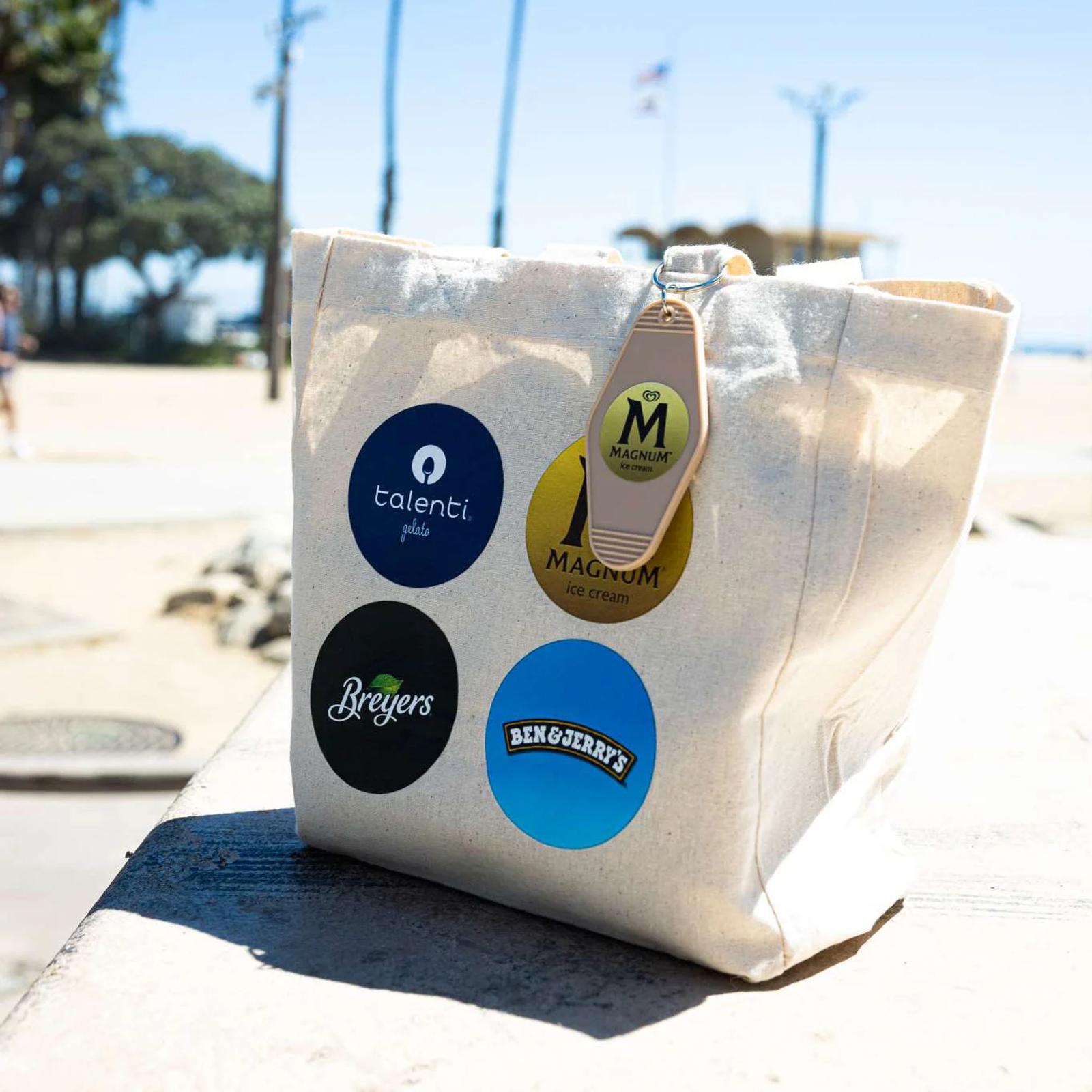Image of a tote bag with Talenti, Magnum, Breyers, and Ben & Jerry's ice cream stickers