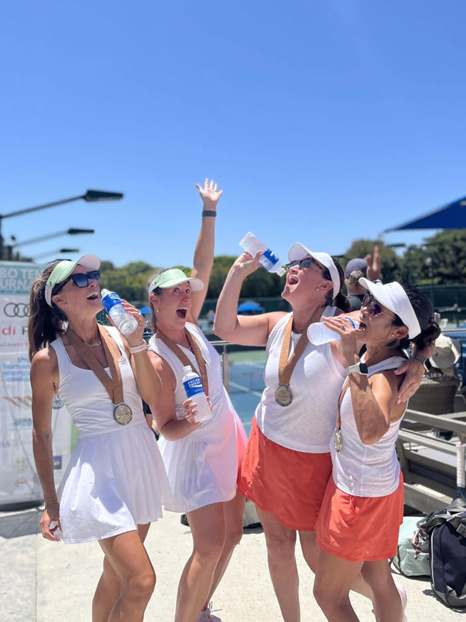Image of tennis players celebrating with beverages during a sports sponsorship activation event
