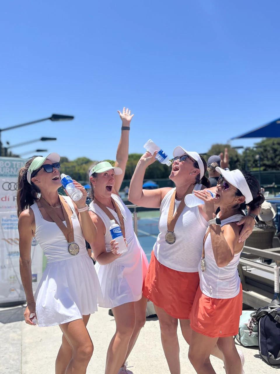 Image of tennis players celebrating with beverages during a sports sponsorship activation event
