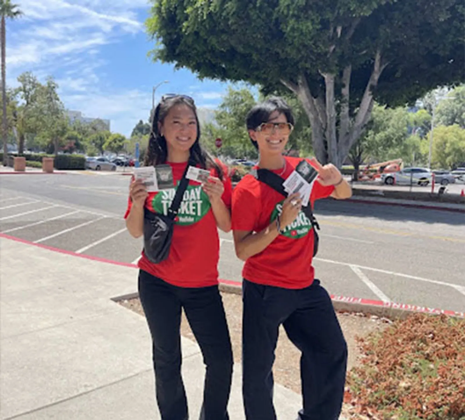 Image of brand ambassadors in Sunday Ticket shirts promoting YouTube TV in a parking lot