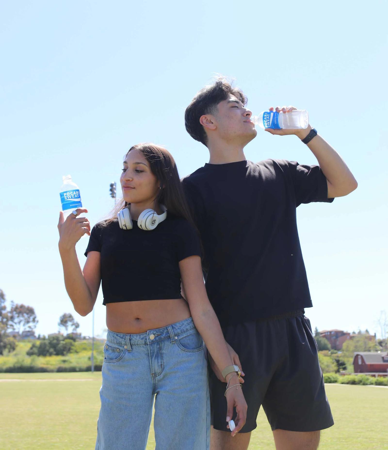 Students holding drinks from brand activation highlighting benefits of experiential marketing