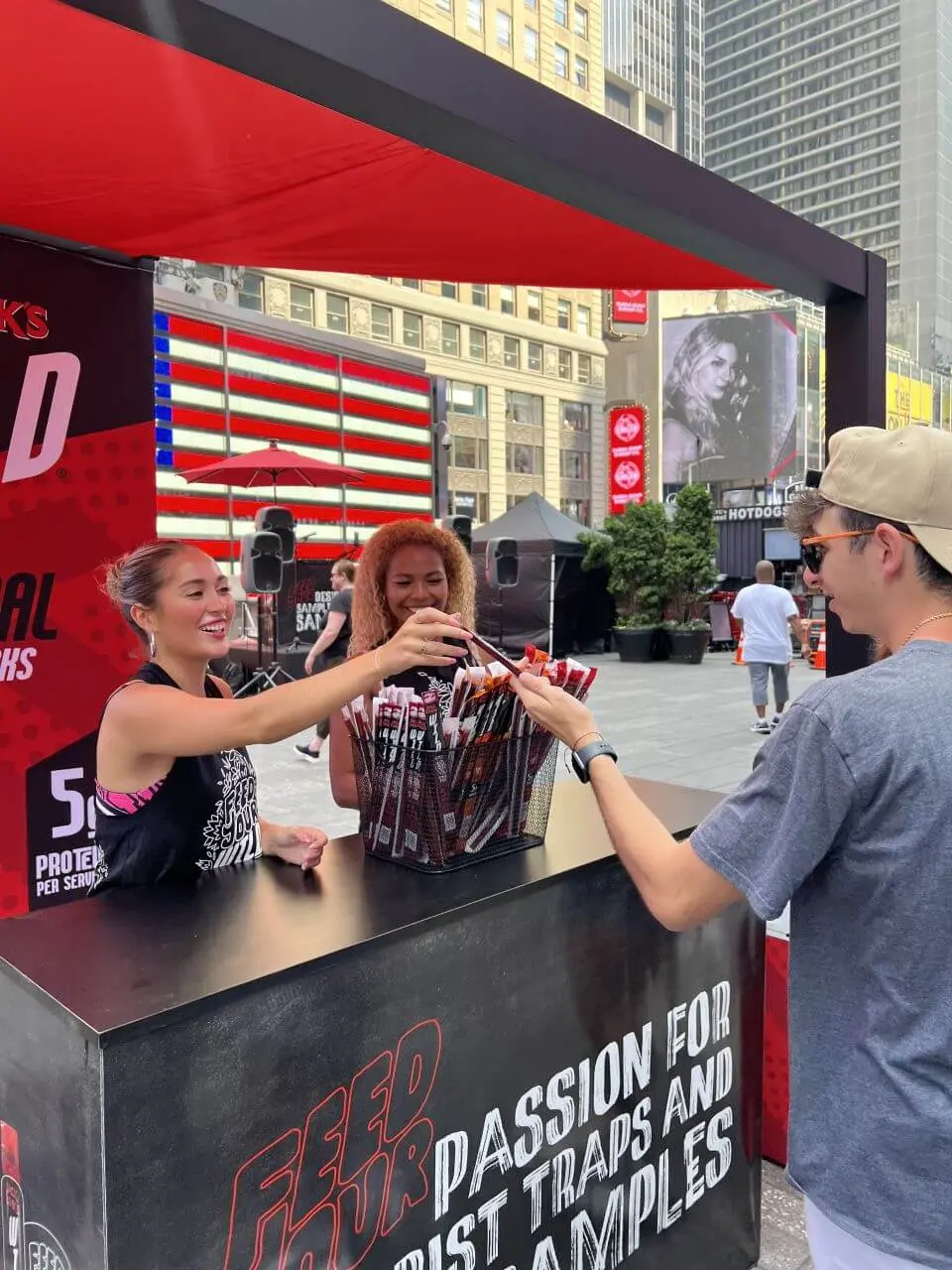 Image of experiential marketing staffing ambassadors distributing product samples at a Times Square activation