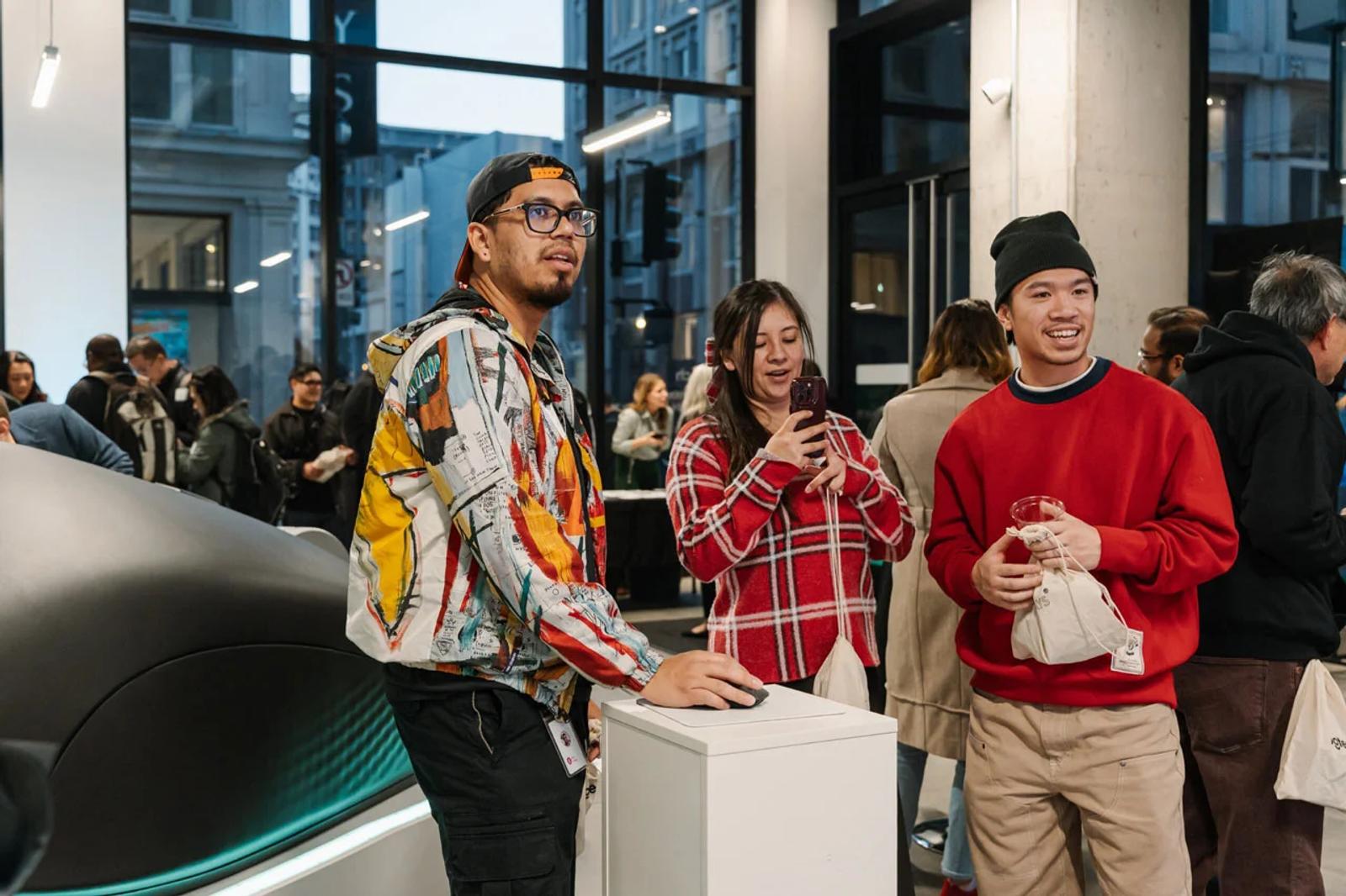 image of attendees interacting with logitech products at an indoor brand activation event