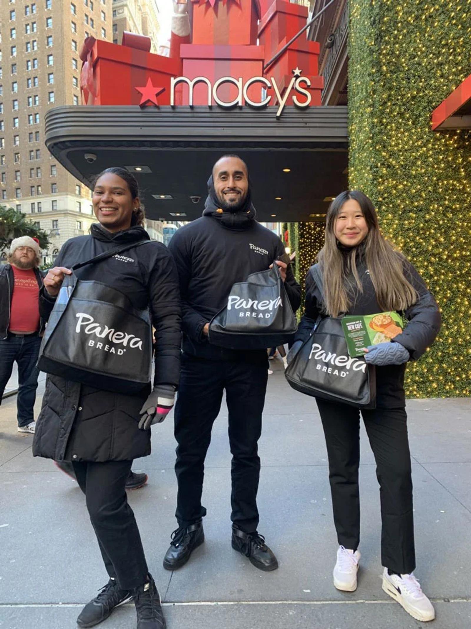Image of Panera Bread brand ambassadors handing out samples outside Macy's during a holiday activation