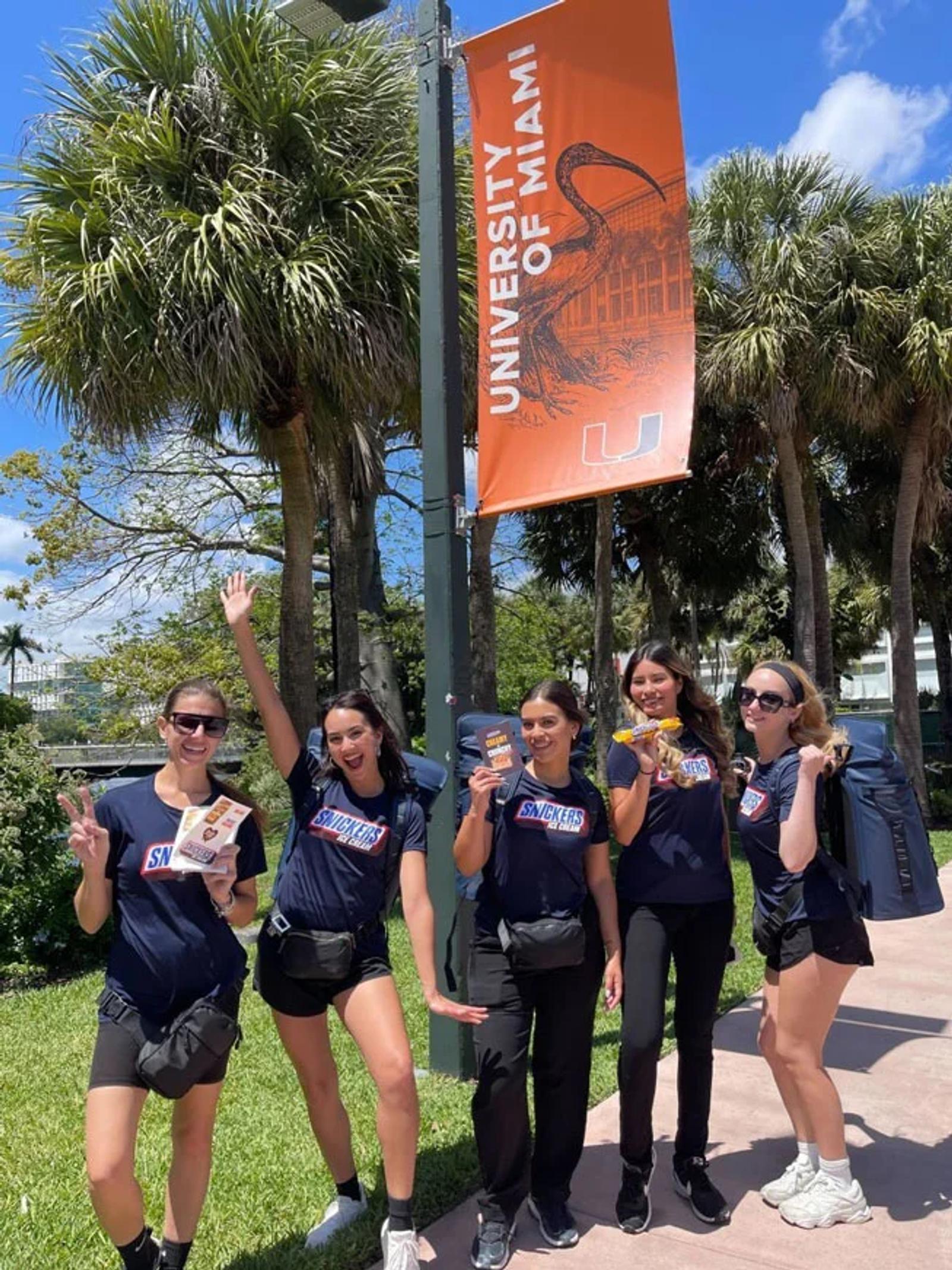 Group of college students at a college marketing pop up 