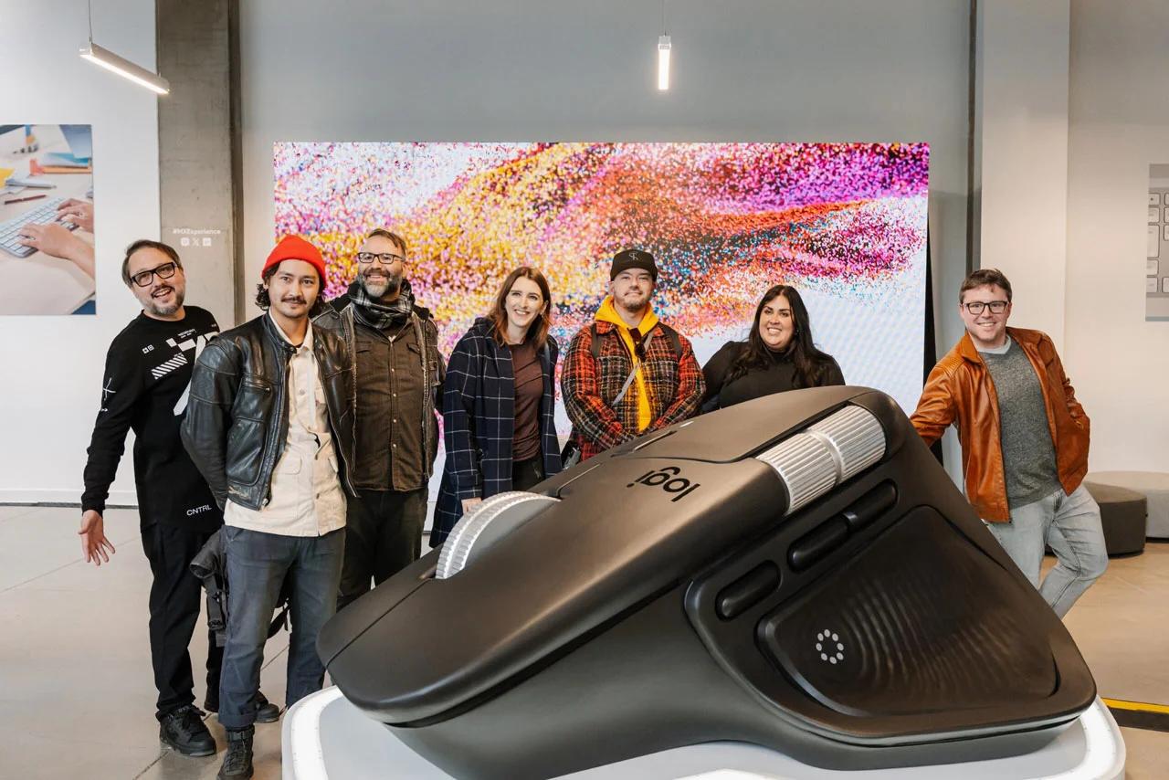 image of immersive brand experience with visitors posing beside a giant Logitech MX mouse display